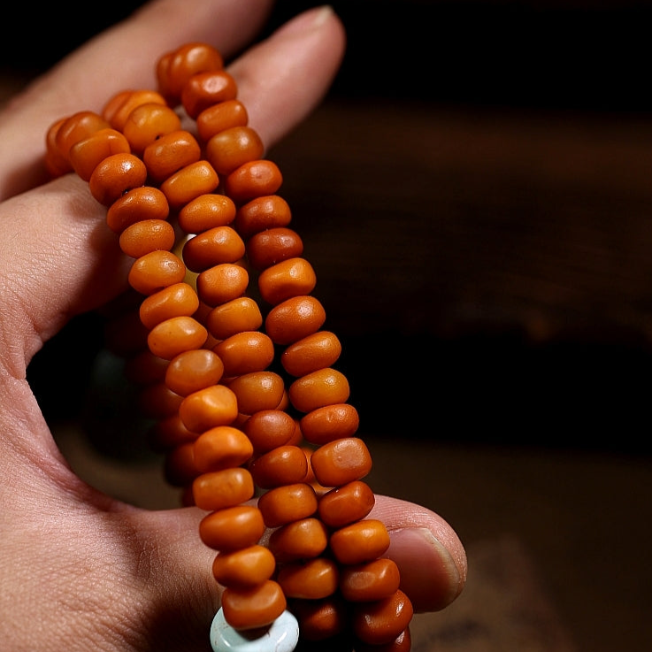 African Amber 108 Mala Beads with Turquoise Carved Jambhala