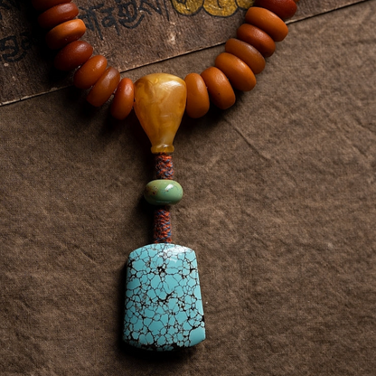 African Amber 108 Mala Beads with Turquoise Carved Jambhala